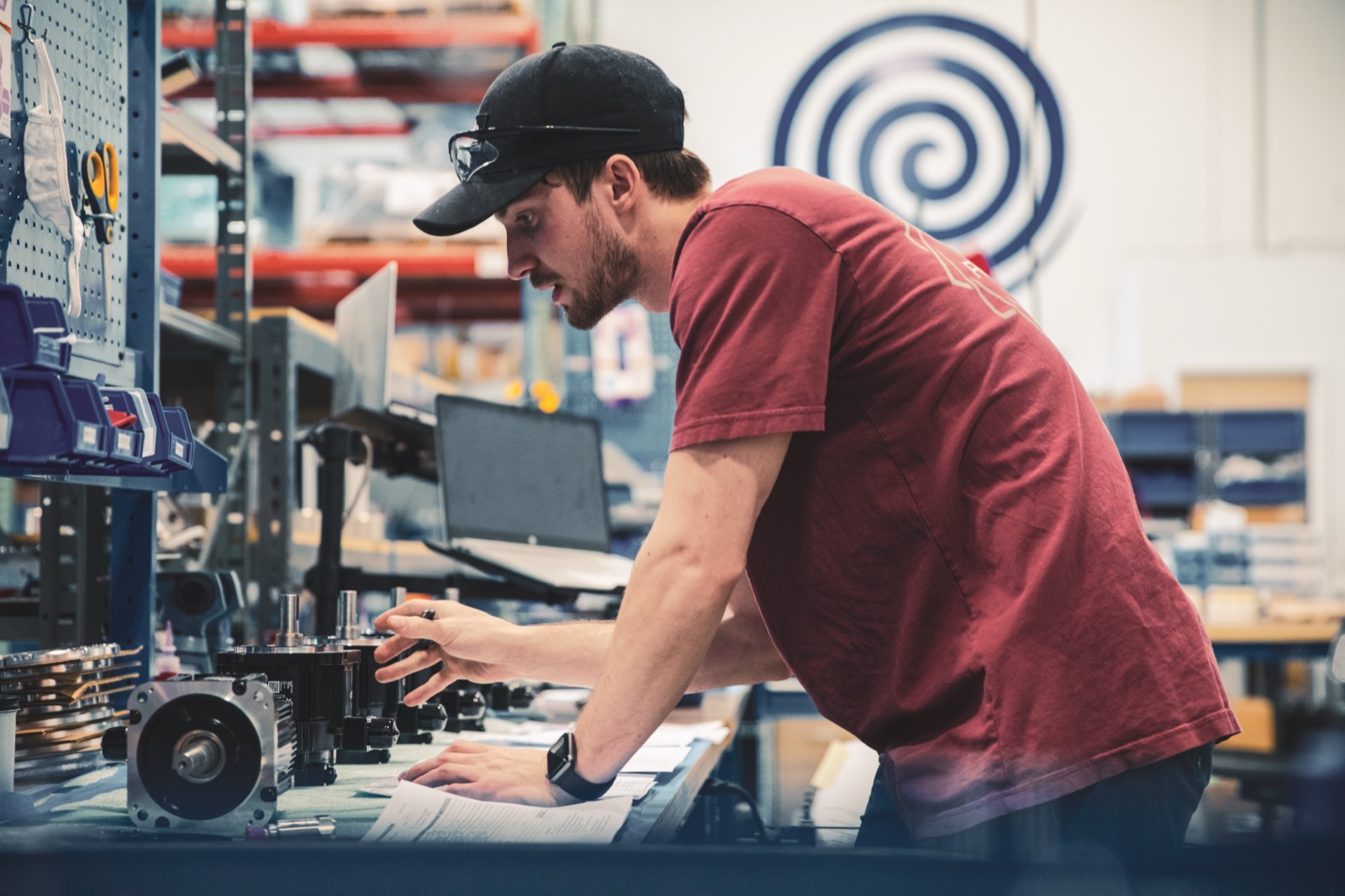 A FlackTek technician servicing a mixer in the applications lab