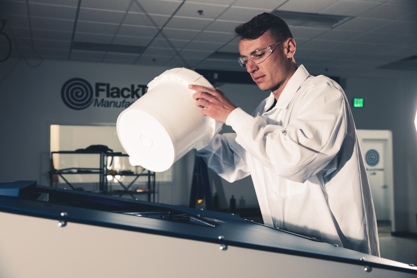 A FlackTek applications engineer working in the lab